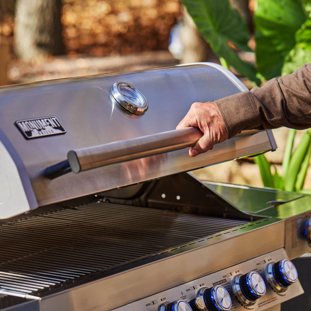Monument Grills 6+1 Burner Propane Gas Grill  84,000 BTU Stainless Steel Outdoor Patio Barbecue Grill  LED Controls , Free Rotisserie Kit , and Easy Cleanup , 77352 Monument Grills